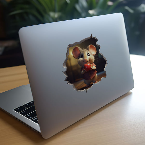 Apple Mouse decal on laptop