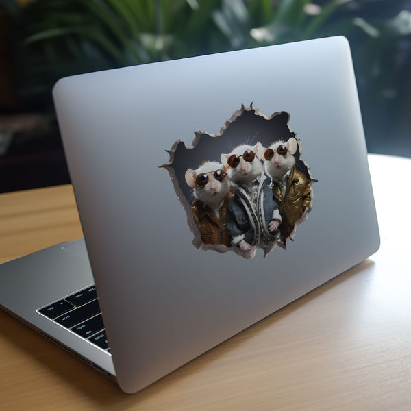 Three blind mice decal on laptop