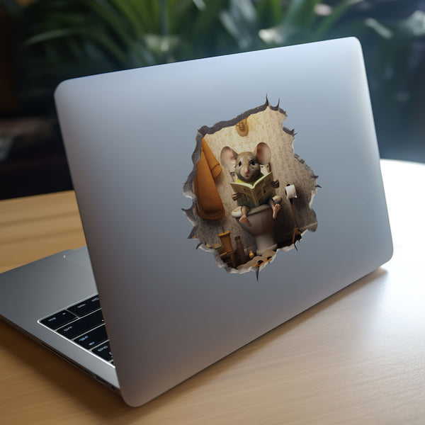Mouse sitting on toilet decal on laptop