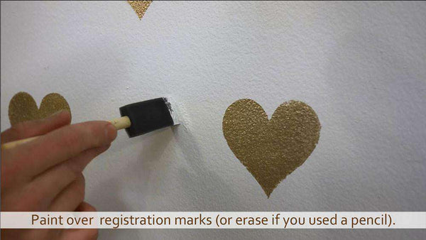 painting hearts with a wall stencil